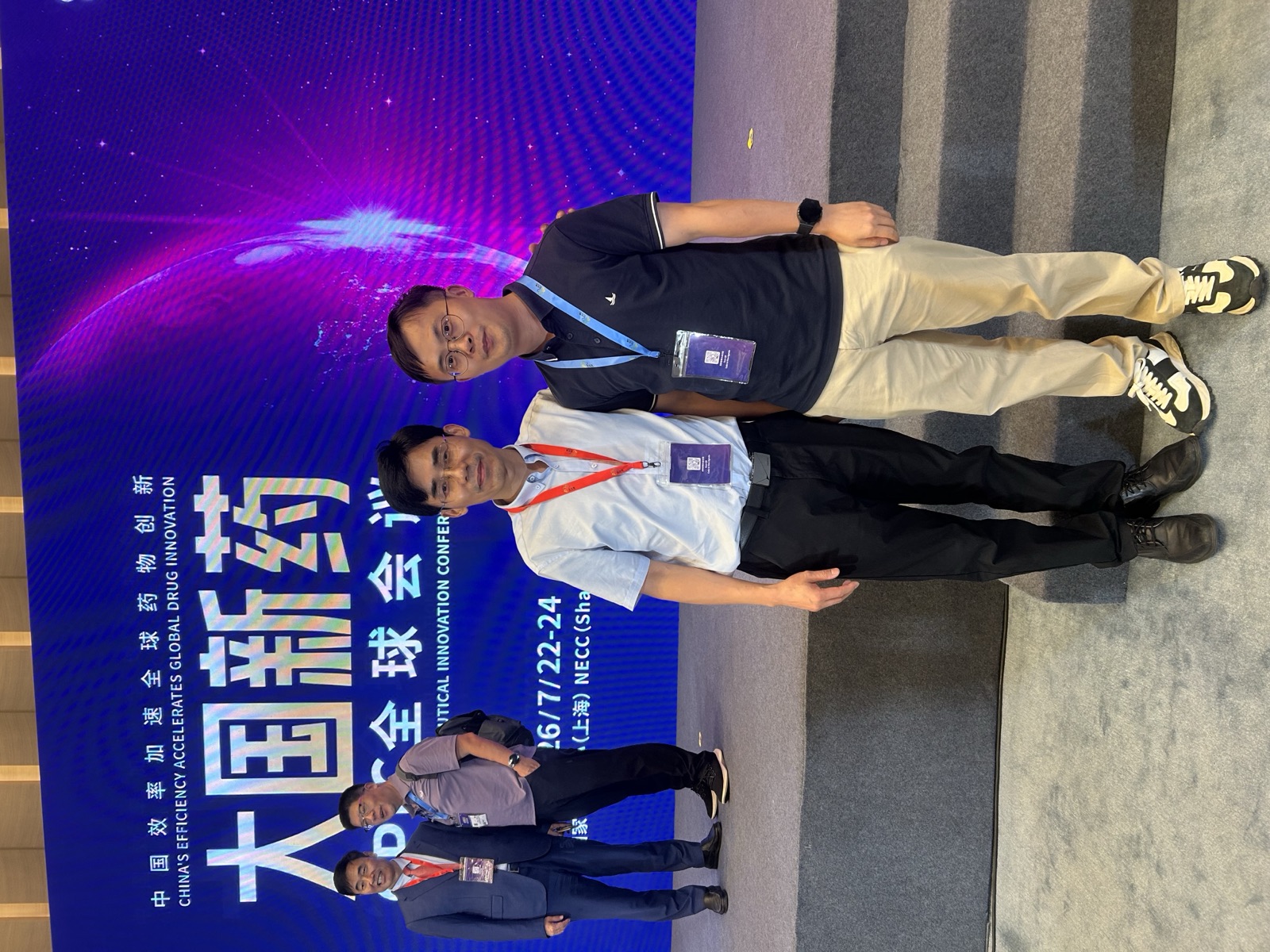 Kerlann's team in front of the CPIC 2026 main stage banner, National Exhibition and Convention Center, Shanghai